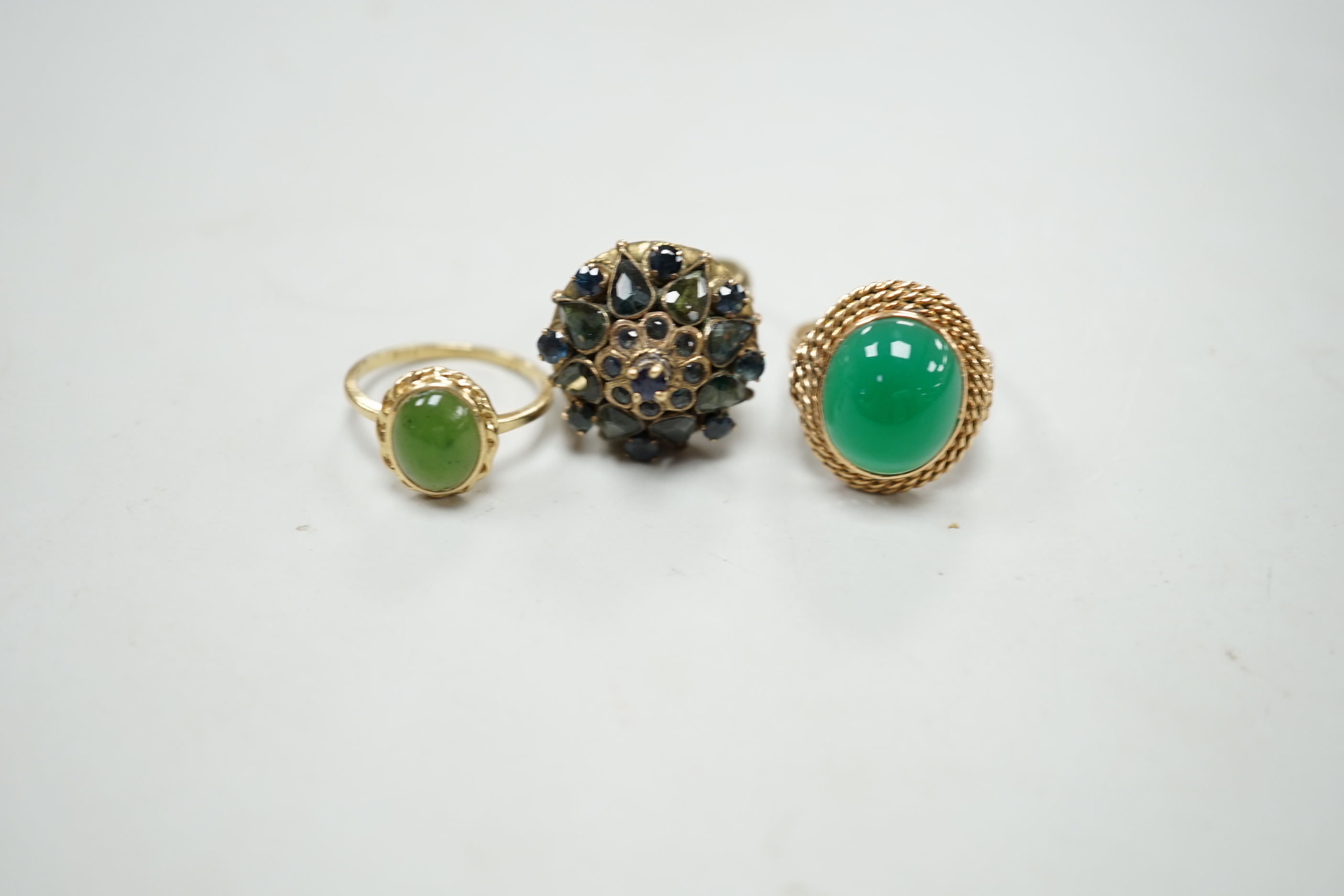 Three assorted yellow metal and gem set dress rings, including 14k and 10k, gross weight 13.2 grams.